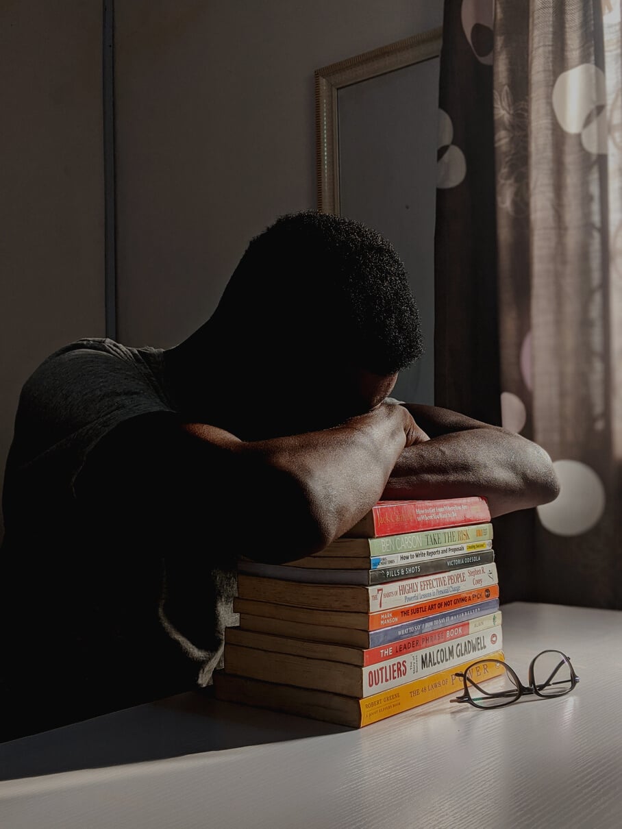 Man Napping on Books